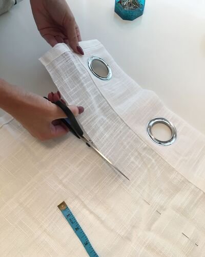 Woman Altering Curtain With Sezer