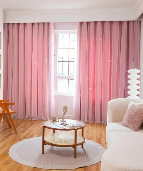 Cozy room featuring pink drapes