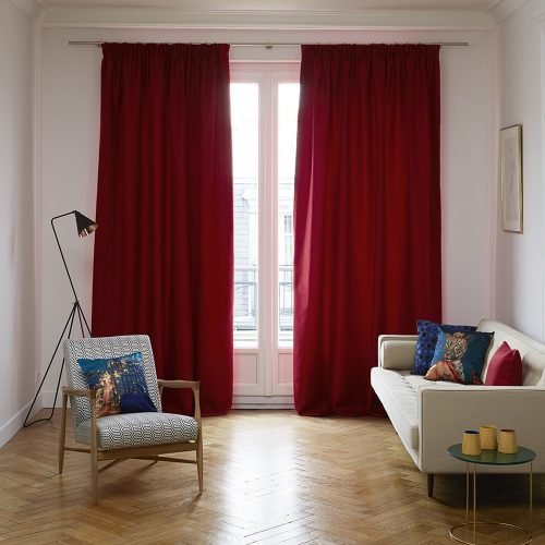 Living room with red curtains