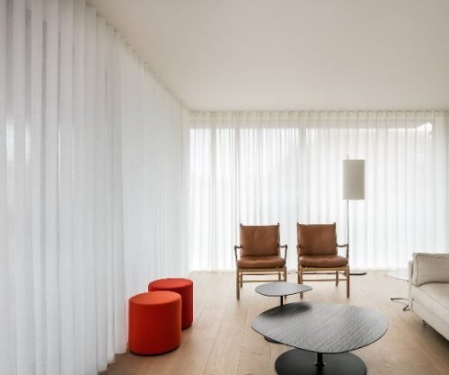 White curtains covering large windows