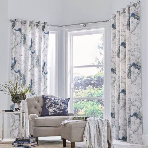 Peacock patterned eyelet curtains in living room