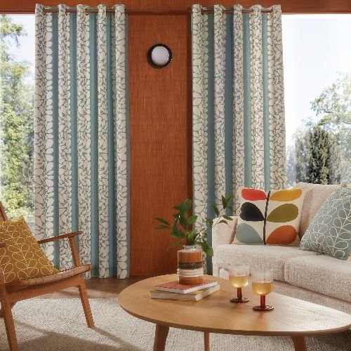 Teal patterned curtains in retro interior